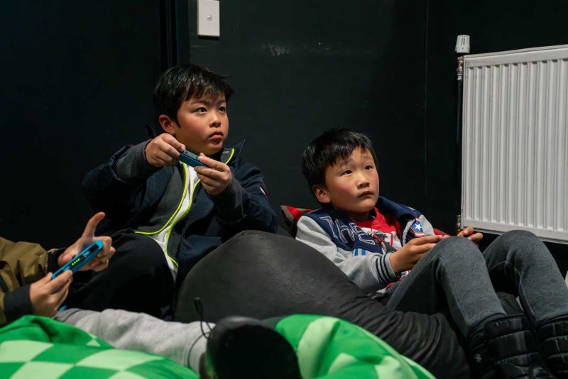 Kids playing games in the games room